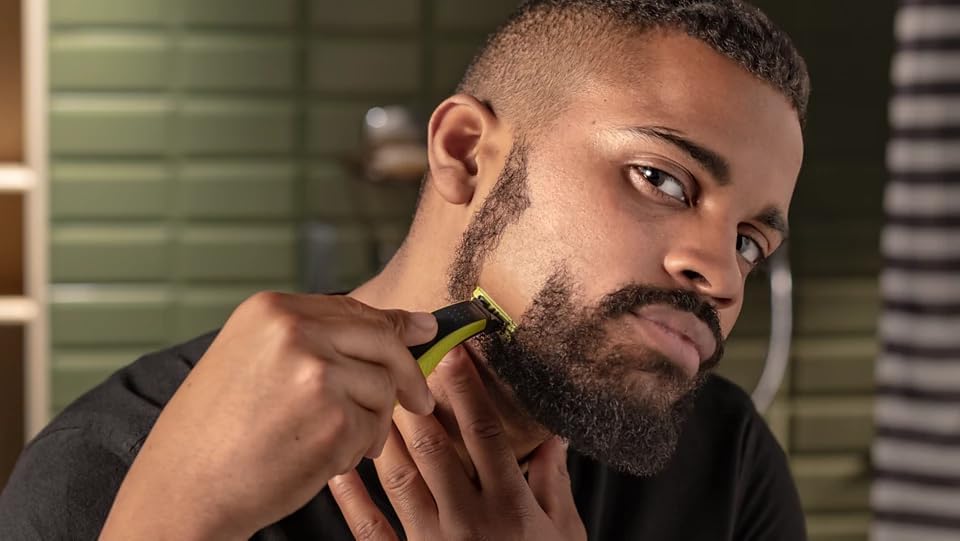 Philips OneBlade Hybrid Body and Face Stubble Trimmer with 4 x Lengths, 2 Extra Blade and Travel Pouch,